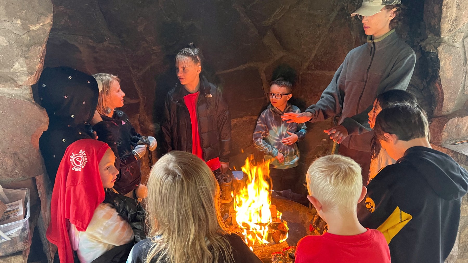 Nature School students gathered around a fire circle at Heart-J Center